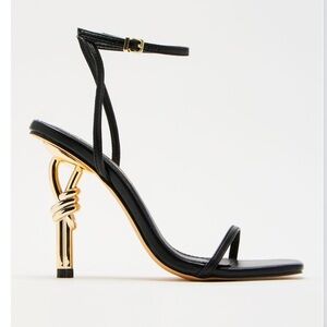 Fashion Nova Black and Gold Heels with Sculptural Design